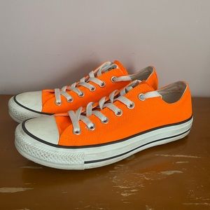 Bright orange low top canvas converse size women’s eight, men’s six.